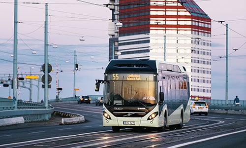 bus driving over a bridge