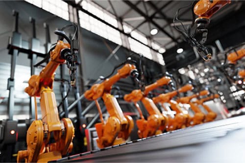 industrial robots standing in a row